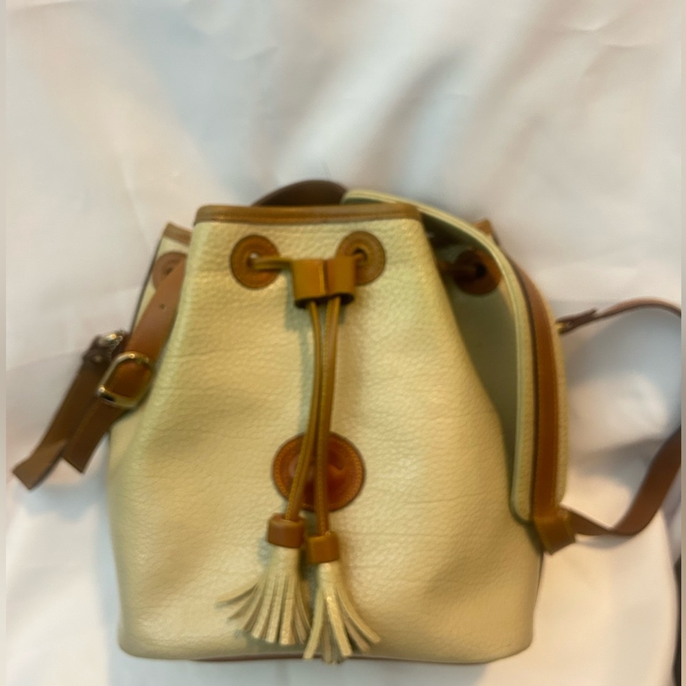 Dooney & Bourke Elegant Cream and Tan Leather Bucket Bag